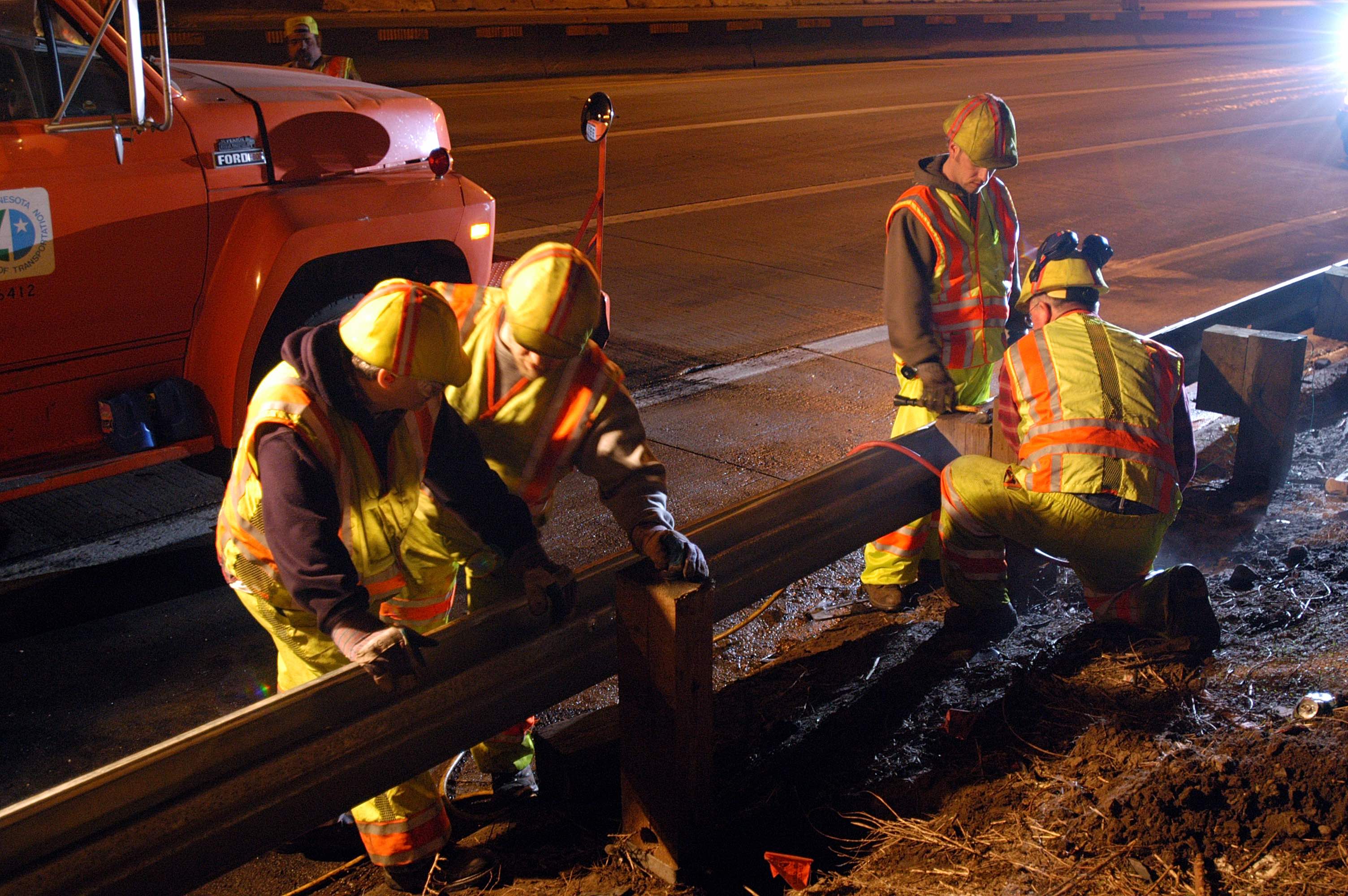 MnDOT workers repairing Guard Rail
